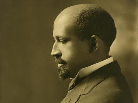 Sepia toned photograph of a man in a suit in profile