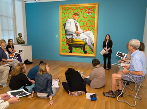 adults in a semi circle around an instructor in the gallery